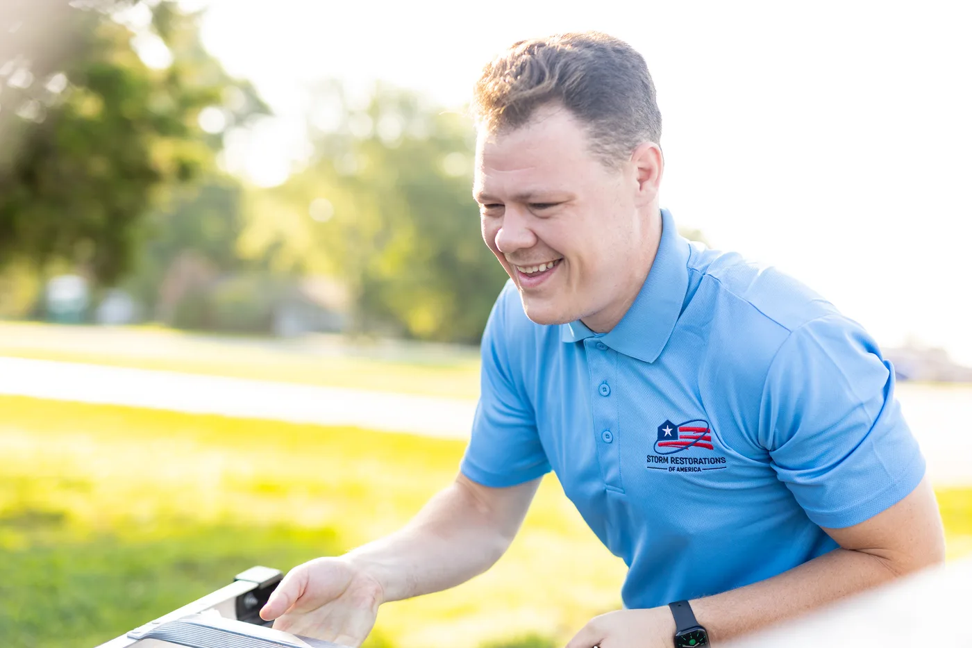 SRA roofing specialist documenting roof inspection findings on a tablet