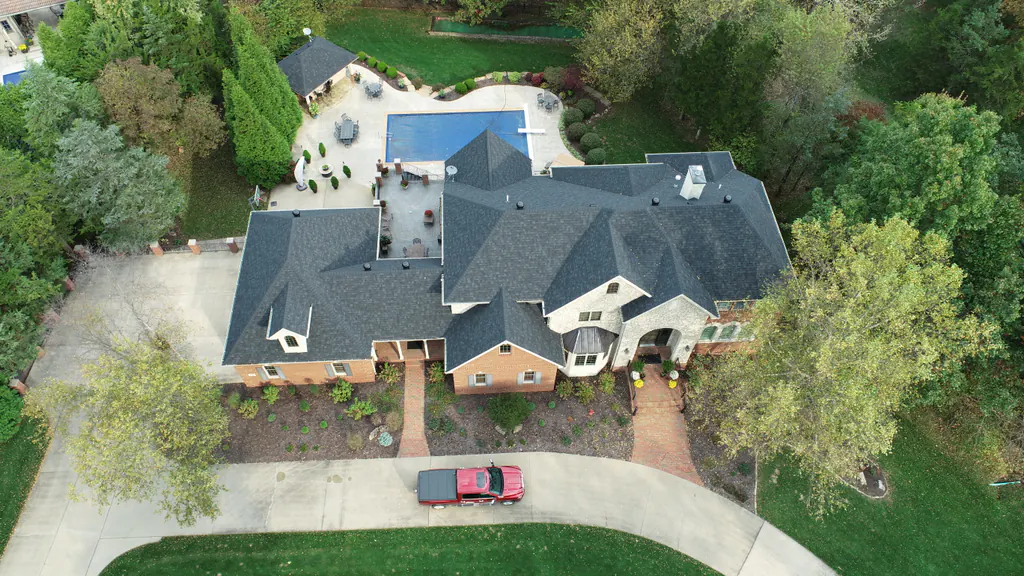 Aerial view of a completed asphalt shingle roof replacement